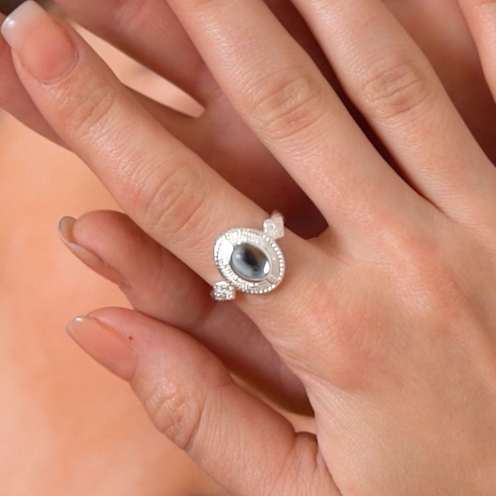 Ornate Ring with Light Blue Stone